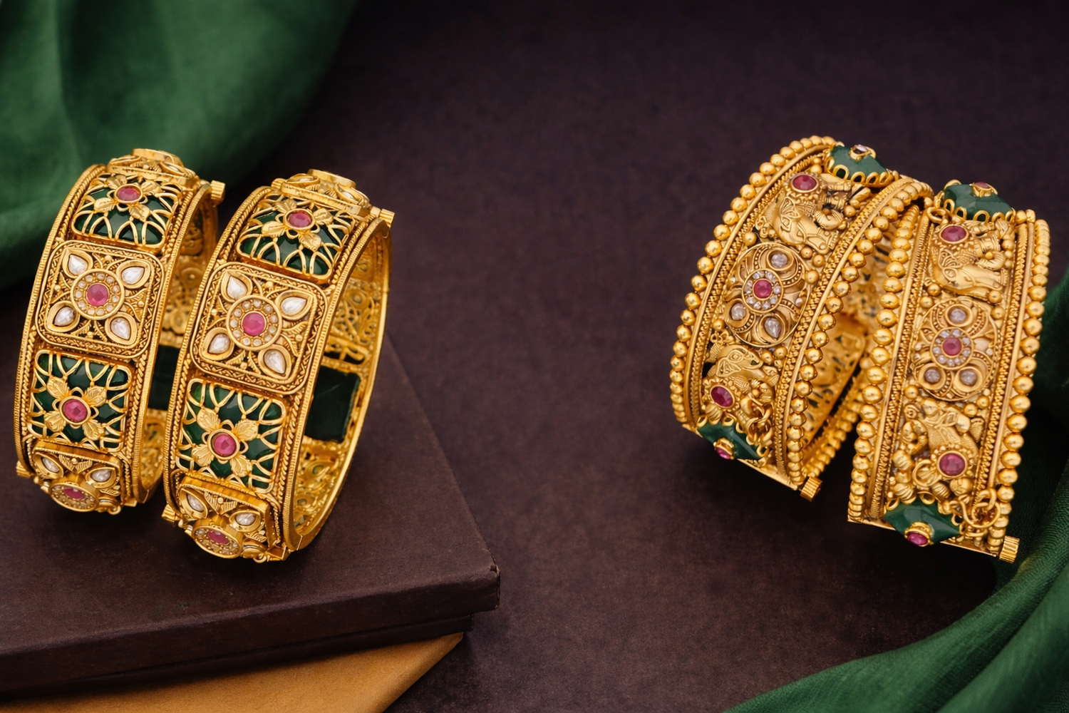Antique brass high gold bangles with red and green stones and intricate elephant designs