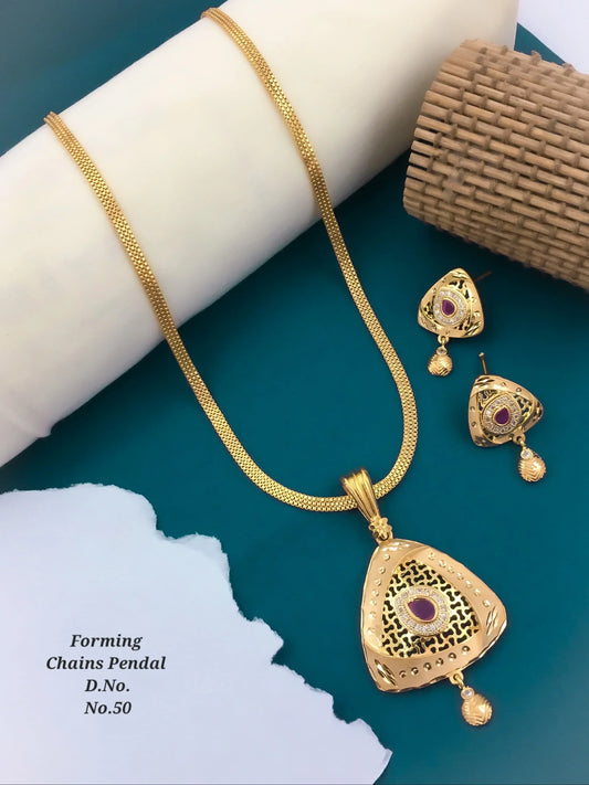 Gold chain necklace with triangular pendant and matching earrings featuring purple stones on blue background