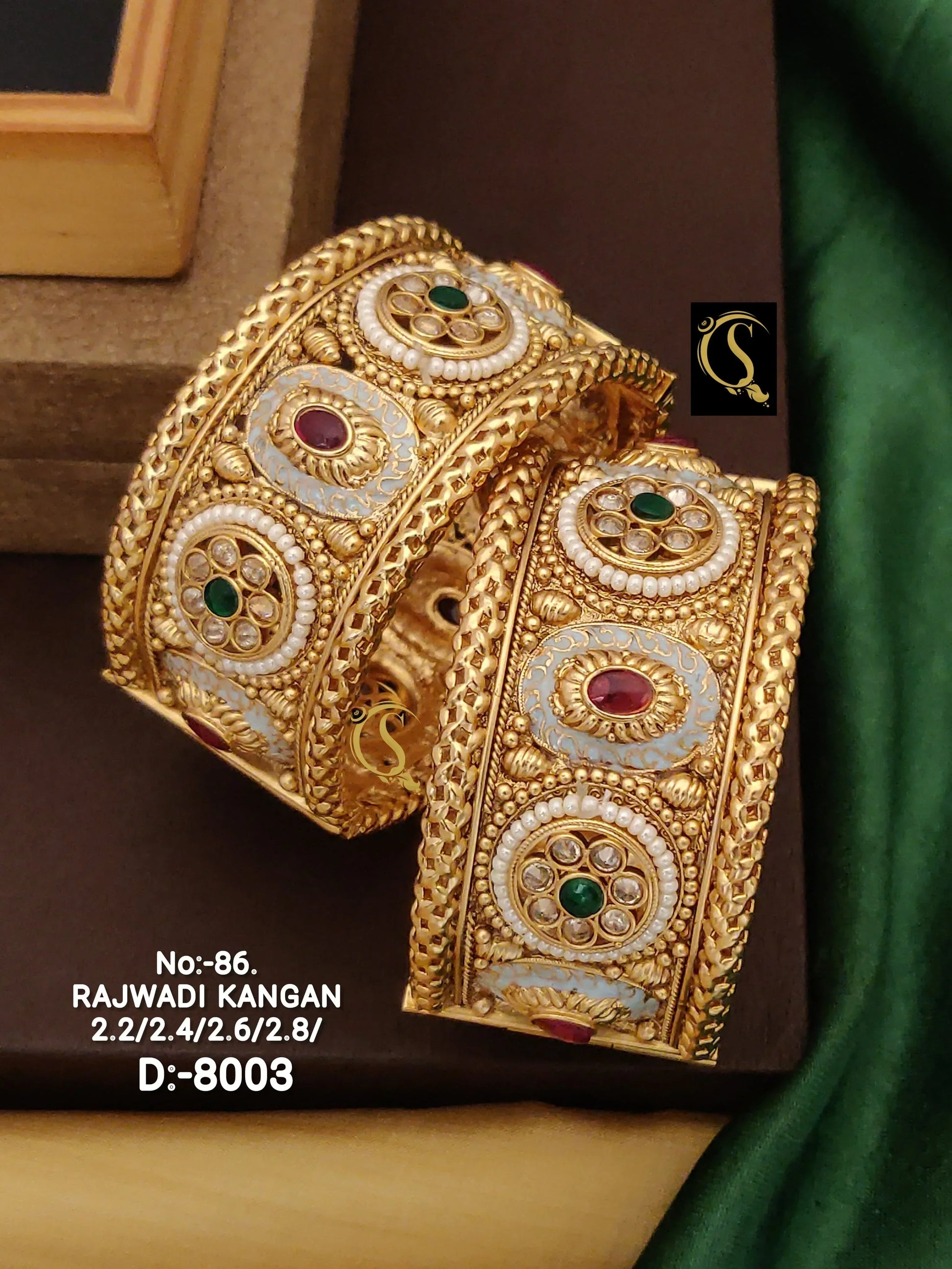 Pair of ornate Rajwadi Kangan gold bangles with intricate gemstone and pearl designs