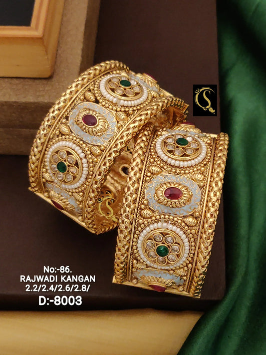 Pair of ornate Rajwadi Kangan gold bangles with intricate gemstone and pearl designs