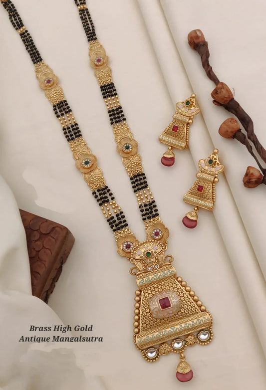 Brass high gold antique mangalsutra necklace with matching earrings on white cloth
